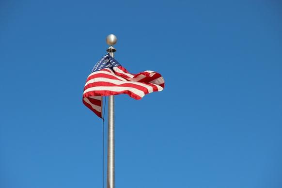 american flag on pole in sky