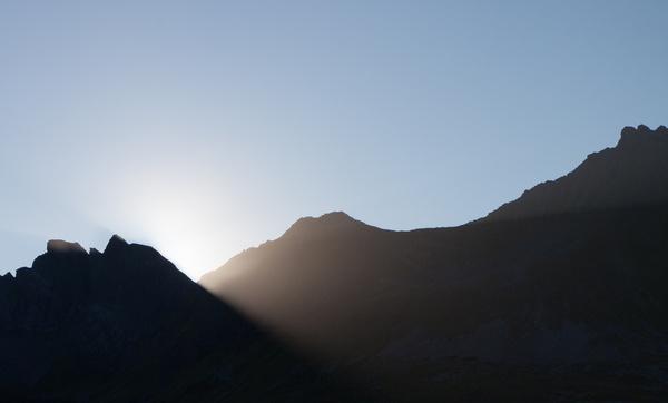 as the sun kisses the mountain
