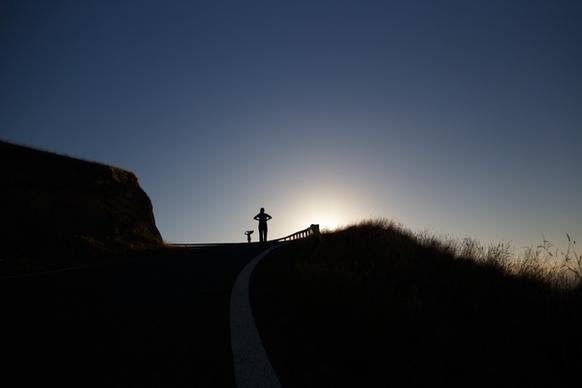 backlit cross dark dawn dusk evening hiking hill