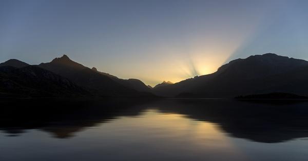 backlit dawn dusk evening fjord fog lake landscape