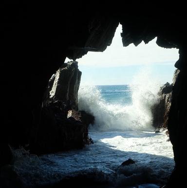 beach black and white cave cliffs coast dark island