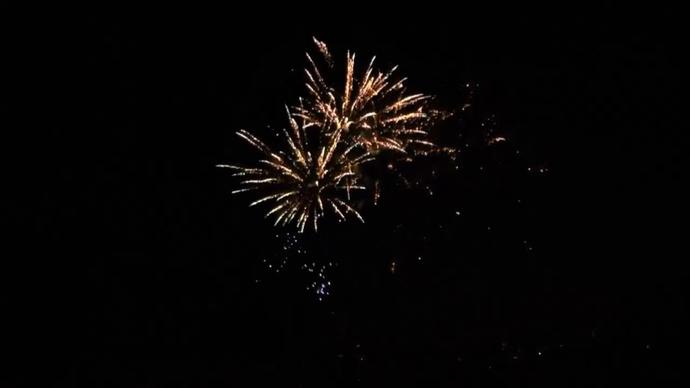 beautiful sparkling fireworks exploding on dark sky