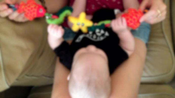 blurred clip of little baby playing with toys