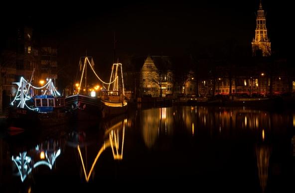 boats in groningen city by night