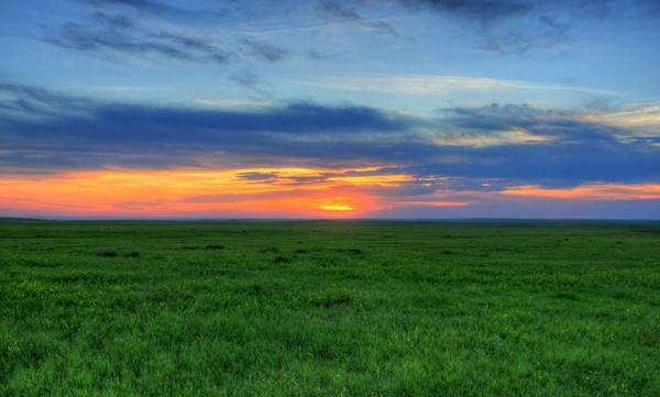 brighter sunset at badlands national park south dakota