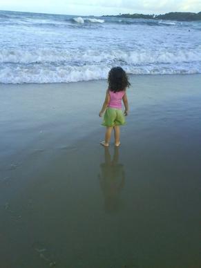 child looking at the sea