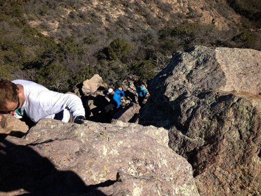 climbing down the rock at big bend national park texas