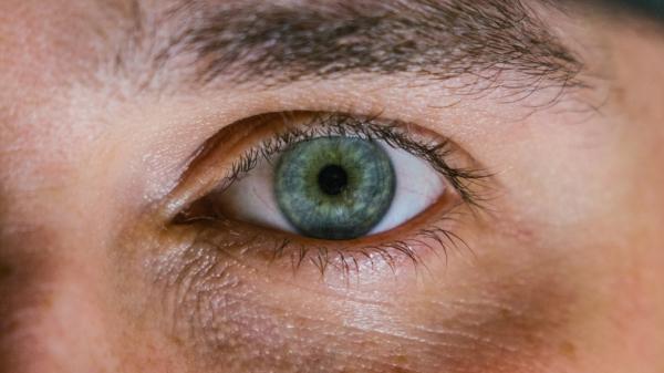 closeup of green eye of man