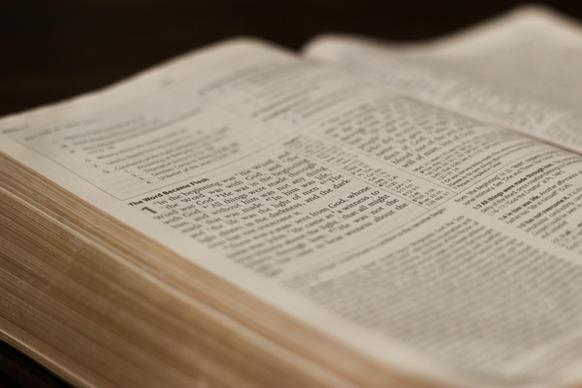 close up of text on open bible