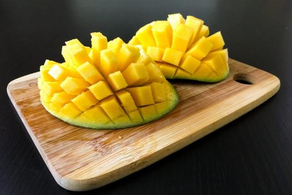 cut up mango on cutting board