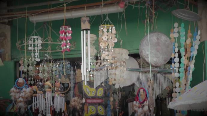 decorated wind chimes swinging in store
