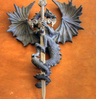 dragon holding sword