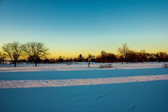 dusk over the snowy landscape at high cliff state park wisconsin