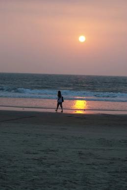 girl walking at sunset