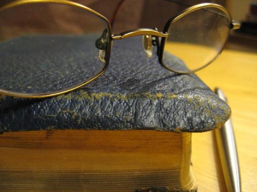 glasses on old book