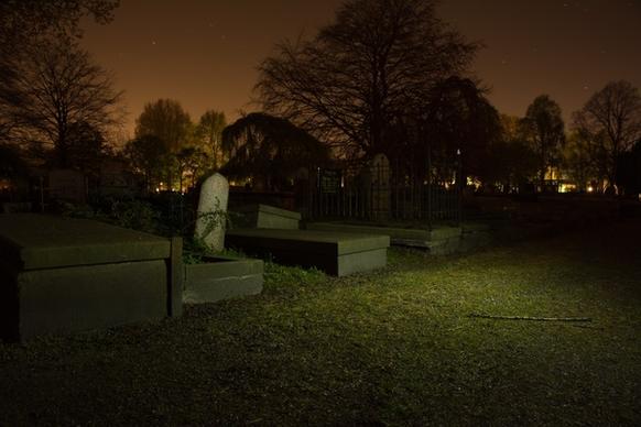 gravestones at night