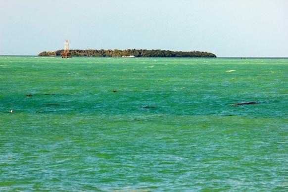 island among blue green water in key west florida