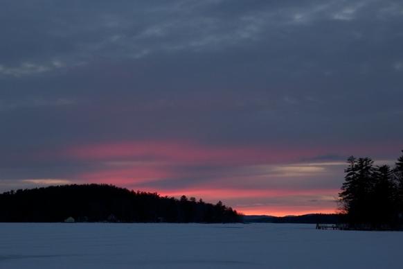 lake ice winter sunset clouds trees