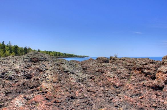 lake superior beyond rock outcropping in the upper peninsula michigan