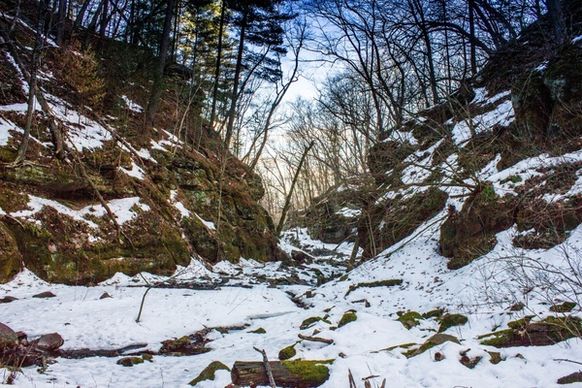 landscape view with snow in the gorge in parfreys glen wisconsin