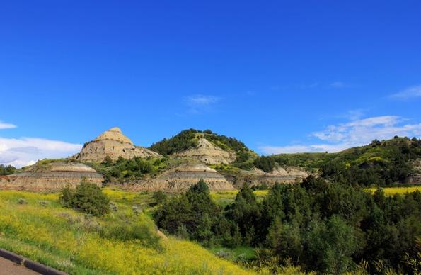 landscape with round hill like structures at theodore roosevelt national park north dakota