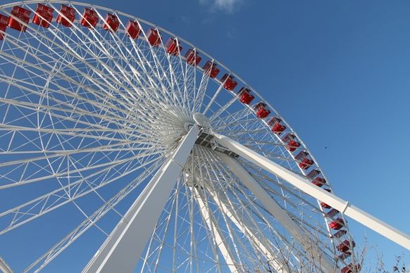 large red 038 white ferris wheel in blue sky