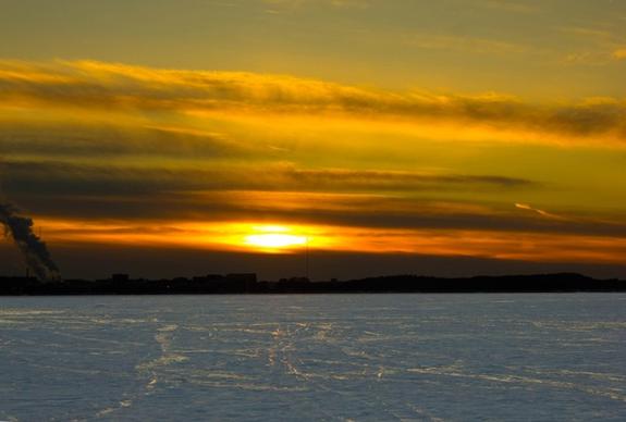 large sunset over snowy mendota in madison wisconsin