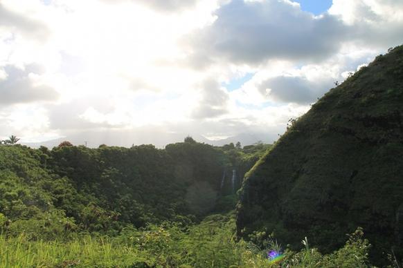 lush jungle hills with waterfalls in distance