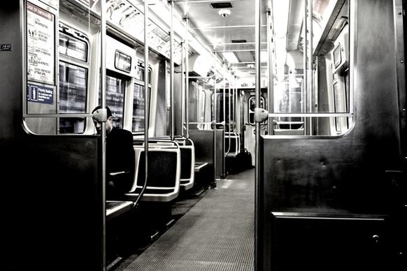 man sitting alone in empty train