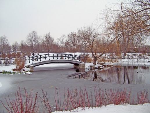 monet bridge in snowcovered park