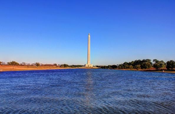 monument from across the pool at san jacinto monument texas