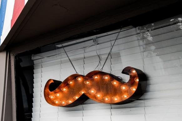 mustache light marquee in window