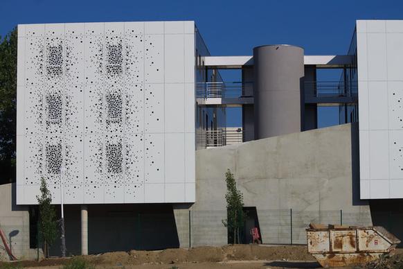 new office building with perforations in the wall
