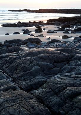 ocean sunrise rocks water seacoast beach