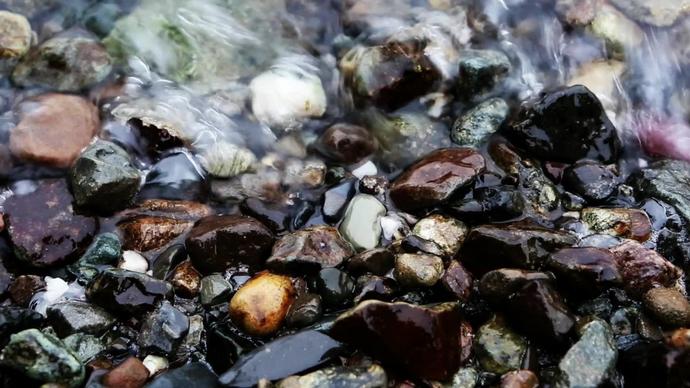 of wave splashing on beach pebbles