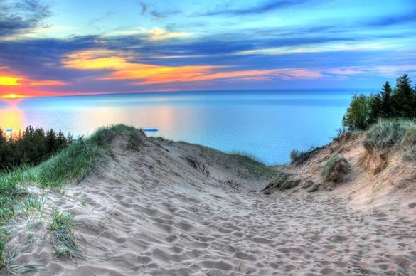 painterly sunset with skies on the sand dunes at pictured rocks national lakeshore michigan