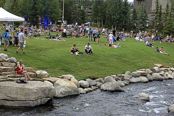 people sitting by the creek at breckenridge colorado
