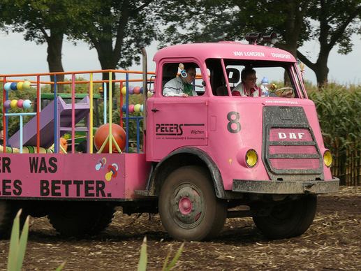 pink truck at black cross