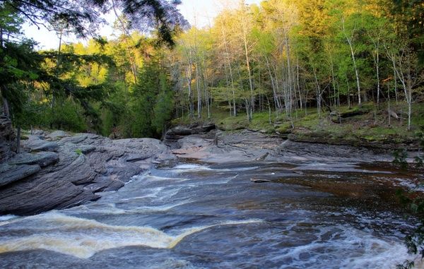 river flowing downstream at porcupine mountains state park michigan