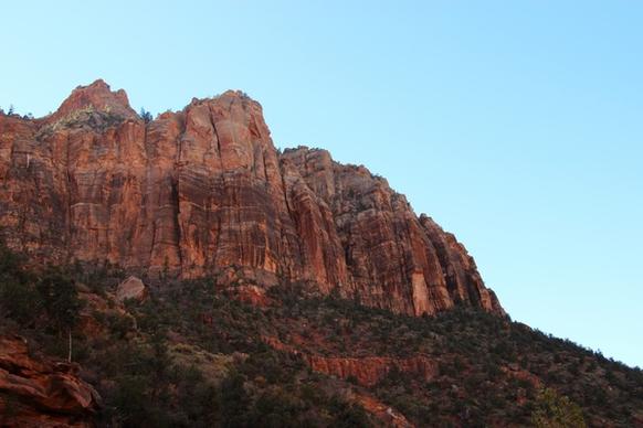 rocky mountain cliffs on blue sky