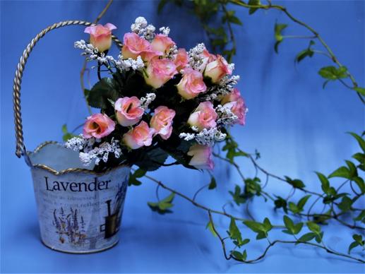 romantic decoration with basket and pink roses