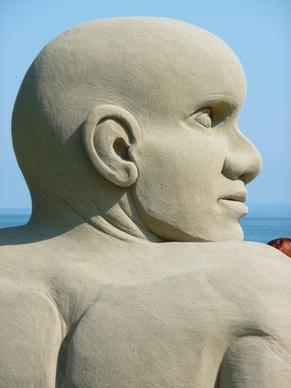 sand sculpture man face
