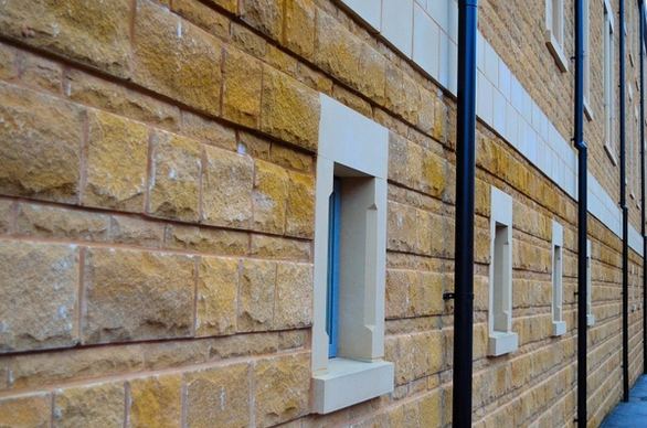 sandstone wall and windows