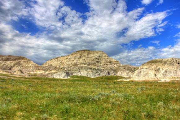 scattered clouds over a peak at white butte north dakota