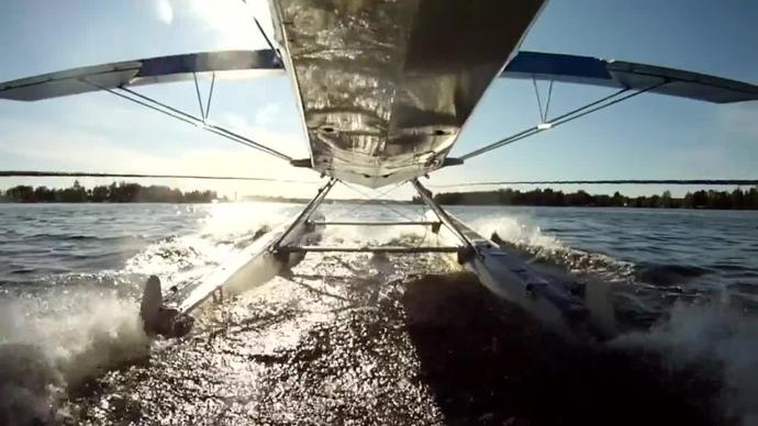 self clip of seaplane taking off on water