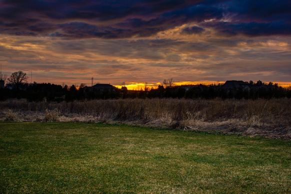 setting sun under the cloudy sky and landscape at fonferek glen wisconsin free stock photo