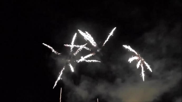 sparkling bright fireworks explosion on night sky