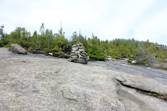 stone statue marker in the adirondack mountains new york