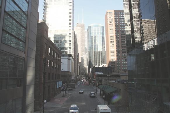 street between tall buildings in downtown city