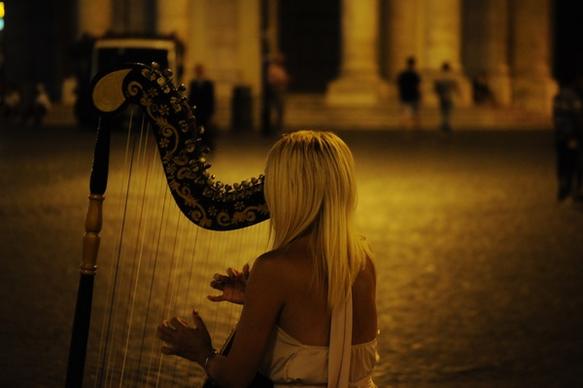 street musician playing harp